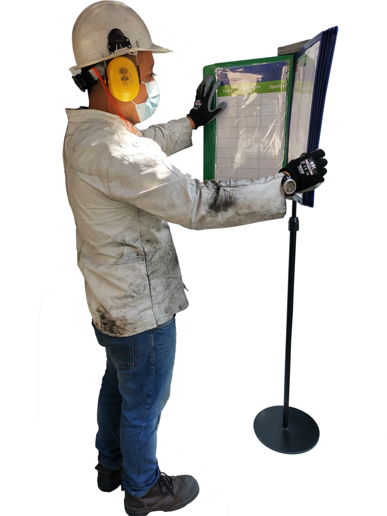 Operator checking work standards on a pedestal